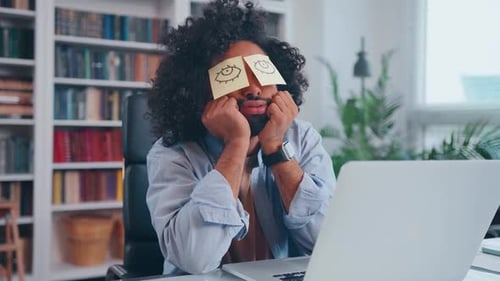 Sleepy Young Arabian Man Napping Experiencing Fatigue and Overwork at Work