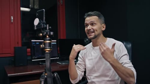 Man Gesturing and Speaking in Studio