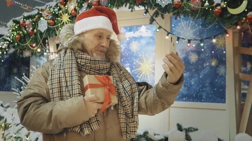 Senior Man Video Calling at Christmas Time