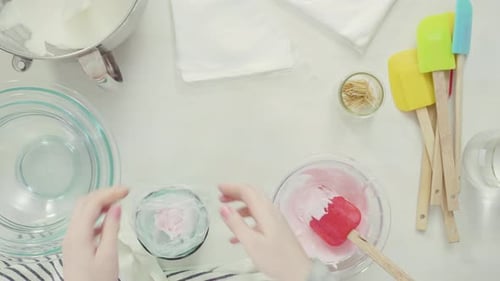 Step by step. Flat lay. Mixing royal icing to decorate Easter sugar cookies.