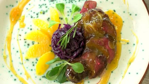 Elegant Beef Dish With Orange and Red Cabbage