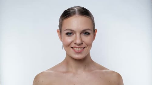 Smiling Young Woman in Studio Close Up