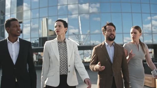 Diverse Business Team Walking and Talking in the City