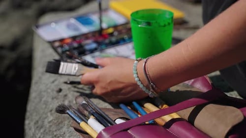 Artist Blending Blue Water Colors for Sea Piece