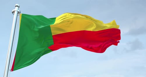 Benin Flag Waving Against a Cloudy Sky