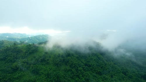 4K Aerial Drone shot flying over beautiful mountain ridge in rural jungle bush forest.