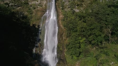Slow Motion Rising Above the Waterfall in the Green Forest in Georgia
