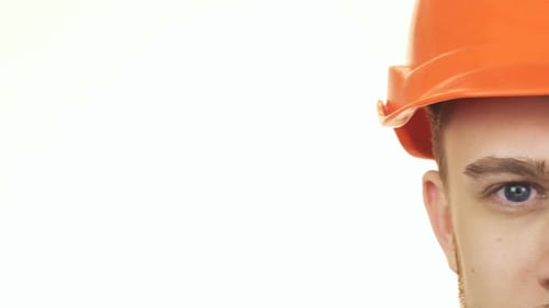 Cropped Shot of the Eyes of a Happy Construction Worker Wearing Hardhat