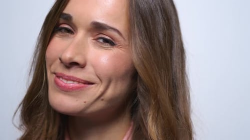 Beautiful Woman Smiles and Winks at the Camera