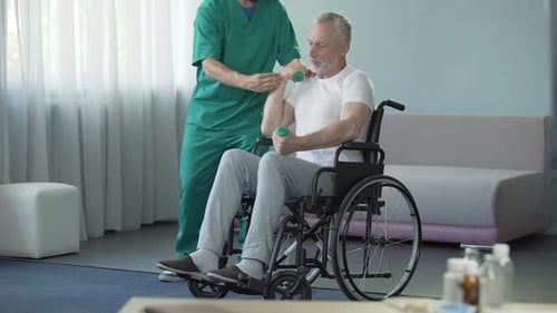 Senior Man Lifts Weights with Medical Assistance