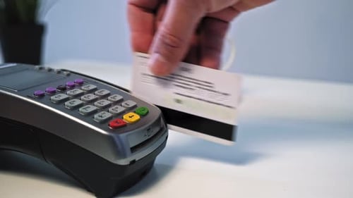 Close-up Shot of Person Using Terminal and Credit Card Performs Contactless Payment and Prints the