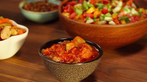 Bowls of Assorted Food on Wooden Table