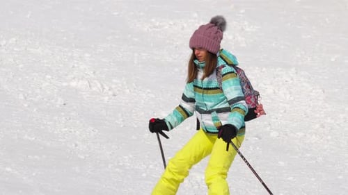 Young Woman Skiing on Snowy Winter Day