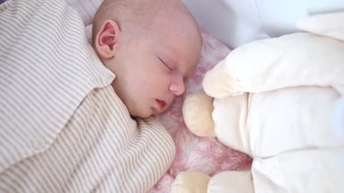 Little Baby Sleeping In Bed. Closeup.