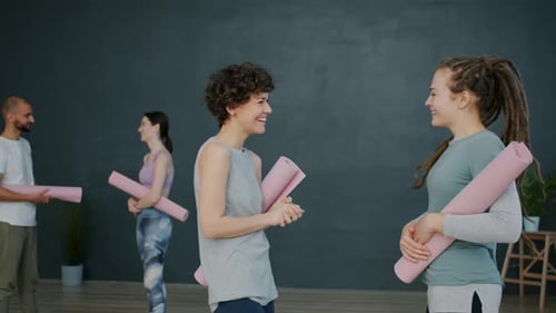 Joyful Girls Friends Talking in Sports Center Then Doing High-five Showing Thumbs-up