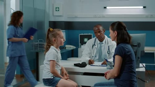 Child and Mother Consult Doctor in Clean Office