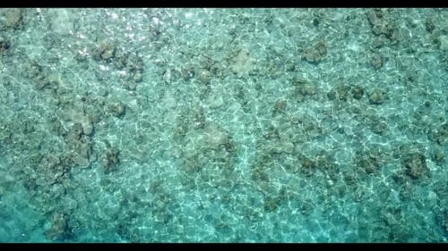 Aerial above scenery of relaxing sea view beach adventure by blue ocean and bright sandy background