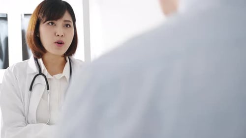 Doctor Consults with Patient in Bright Office