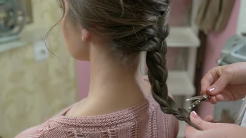 Hands of Hairstyist Braid