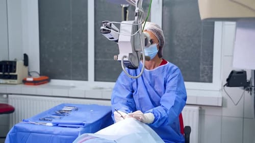 Surgeon performing laser eye vision correction