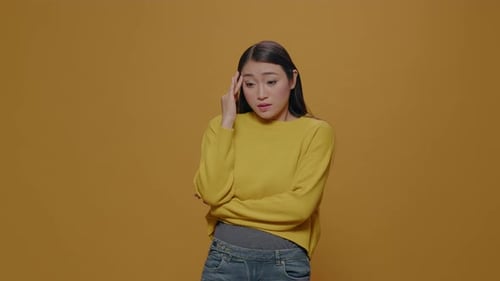 Woman With Hand to Forehead, Upset