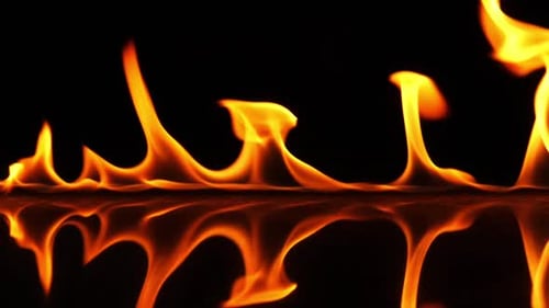 Flames Flickering Against Black Background