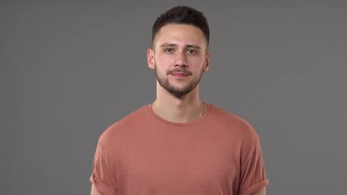 Smiling Young Man Portrait in a Studio