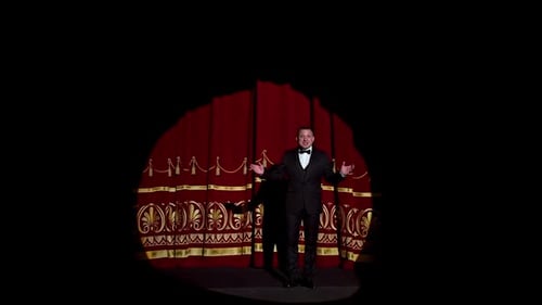 Announcer on a stage in theater.