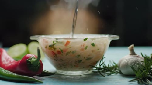 Steaming Noodle Soup with Vegetables and Herbs