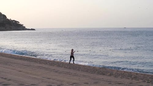 Drone View of Fit Woman During Speed Run on Beach