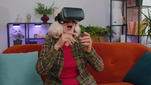 Senior Woman Enjoys Virtual Reality at Home