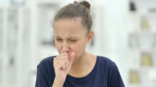 Young Adult Woman Coughing with Sore Throat