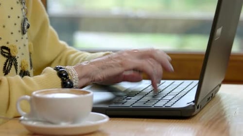 Old Hands and Laptop