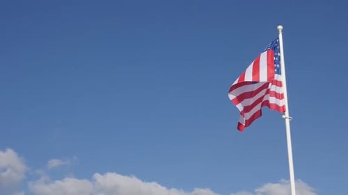American Flag Ripples in the Wind on Blue Sky