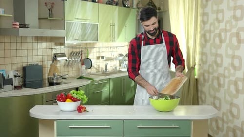 Man Cutting Tomato