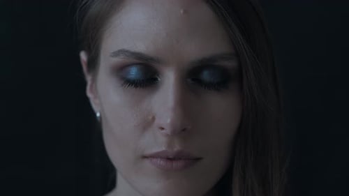 Portrait of a Beautiful Woman on a Black Background