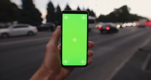 Mockup Male Hand Holding Smartphone with Green Screen