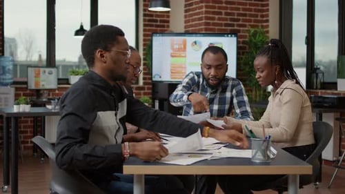 Diverse Team Collaborates in Modern Office Meeting