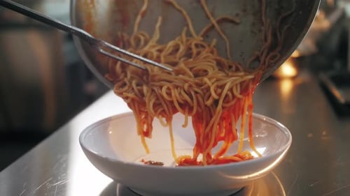 Delicious Spaghetti Being Served in Restaurant Kitchen