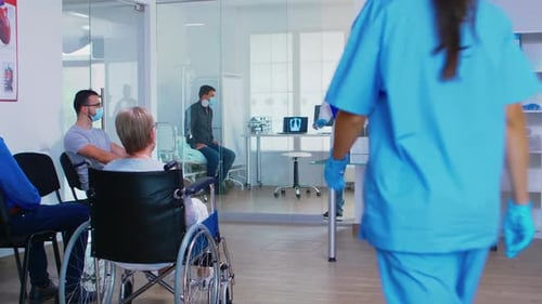 Discussing with Nurse in Hospital Waiting Area