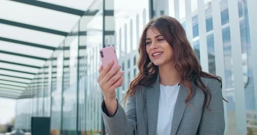 Woman on Video Call Outdoors in the City