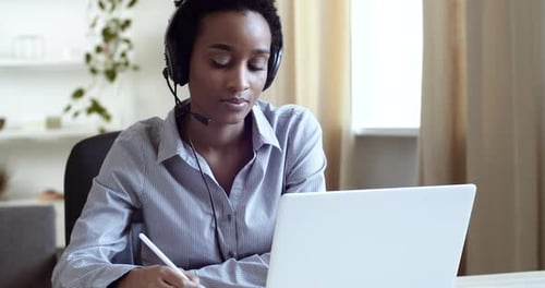 Woman Working at Home Office with Laptop