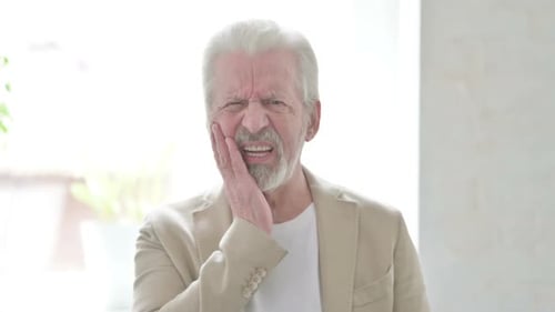 Senior Man Experiencing Intense Tooth Pain