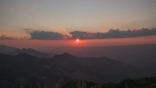 Mountain Range at Sunrise with Clouds and Light
