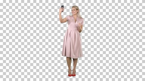 Mature woman wearing light pink dress making selfie, Alpha Channel Mature woman wearing light pink dress making selfie, Alpha Channel