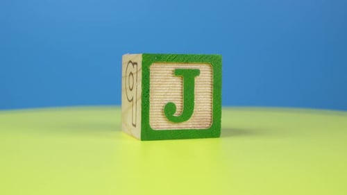 Close up shot letter "J" alphabet wooden block