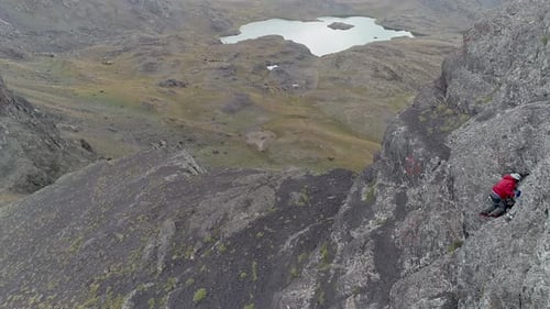 Man Climbing Lakes and Mountains