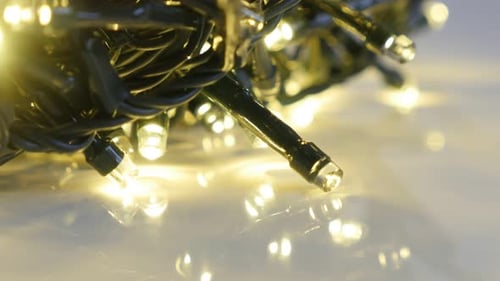 Sequence of blinking fairy lights 4K 2160p 30fps UltraHD footage - Warm Christmas decorative backgr