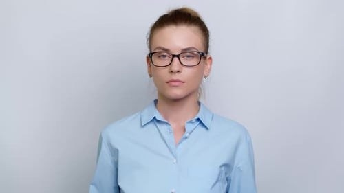 Young Woman Massaging Temples in Mid Shot