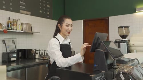 Young Adult Barista Working at Point of Sale